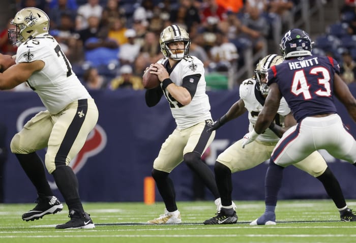 Aug 13, 2022; New Orleans Saints quarterback Andy Dalton (14) looks for a receiver during a game against the Houston Texans. Mandatory Credit: Troy Taormina-USA TODAY